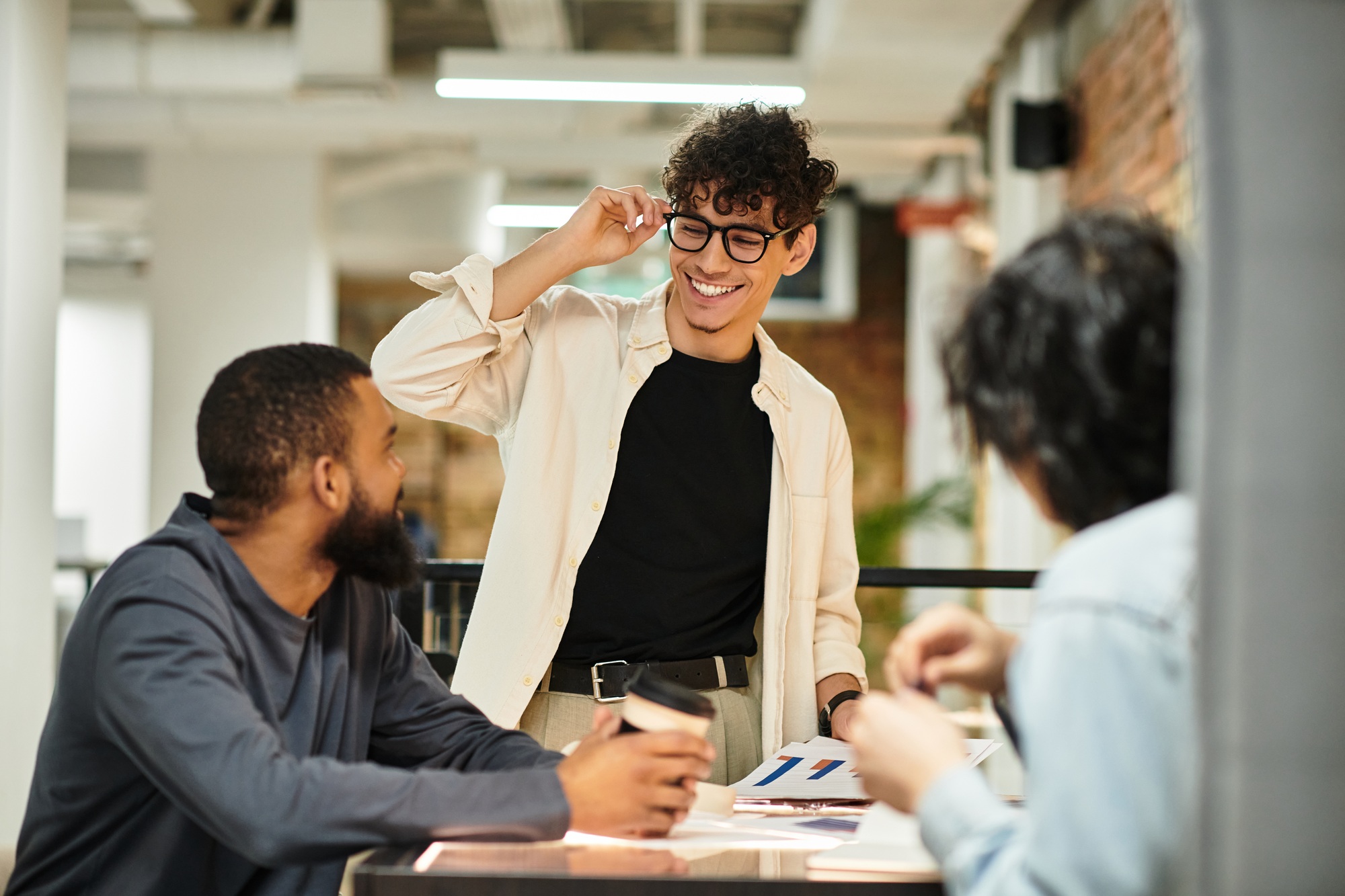 Engaging collaborative meeting among team members in a modern office space